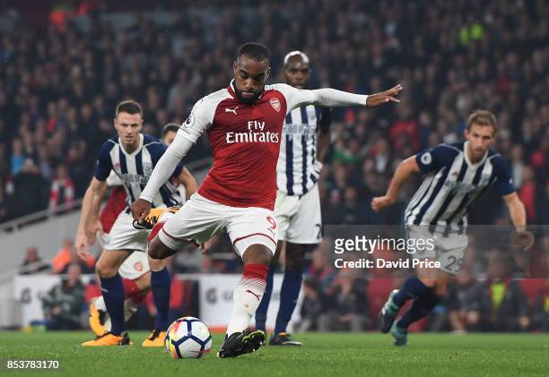 Alexandre Lacazette scores his and Arsenal's 2nd goal from the penalty spot during the Premier League match between Arsenal and West Bromwich Albion...
