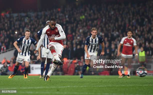 Alexandre Lacazette scores his and Arsenal's 2nd goal from the penalty spot during the Premier League match between Arsenal and West Bromwich Albion...