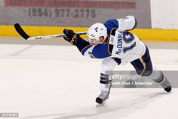 Andy McDonald of the St. Louis Blues shoots the puck against the Florida Panthers at the Bank Atlantic Center on March 7, 2009 in Sunrise, Florida.