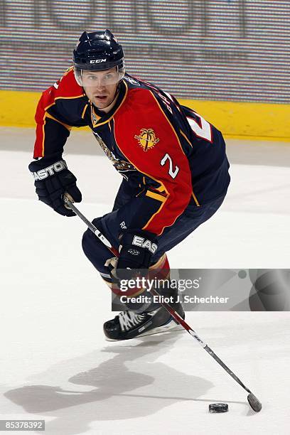 Keith Ballard of the Florida Panthers skates with the puck against the St. Louis Blues at the Bank Atlantic Center on March 7, 2009 in Sunrise,...