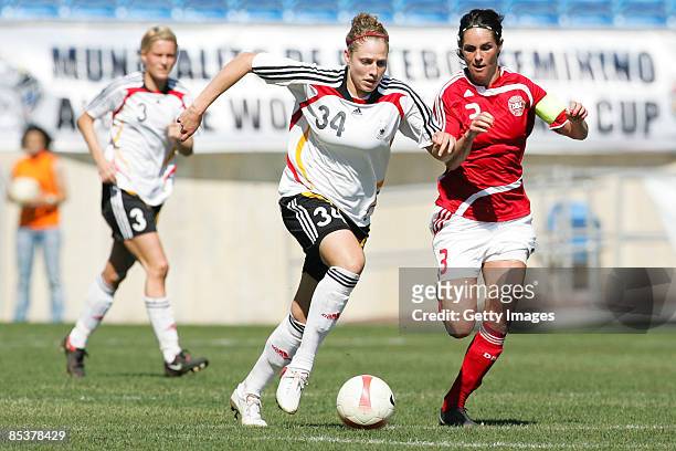 Kim Kulig of Germany fights Katrine S. Pedersen during the Woman Algarve Cup match between Germany and Denmark at the Estadio Algarve on March 11,...