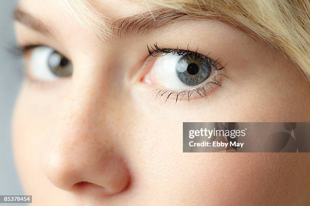 eyes of young woman, close-up - close up eye side stock pictures, royalty-free photos & images