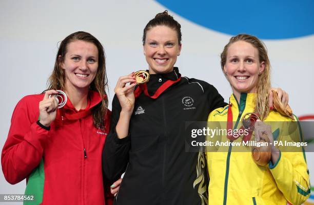New Zealand's Lauren Boyle collects her gold medal for the Women's 400m Freestyle Final alongside silver medalist Wales' Jazz Carlin and bronze...