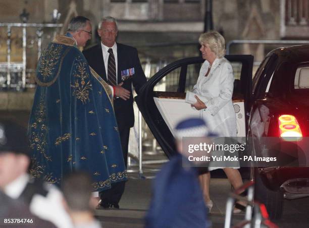 The Very Reverend Dr John Hall, Dean of Westminster, greeting The Duchess of Cornwall as she arrives for a candle lit prayer vigil and solemn...