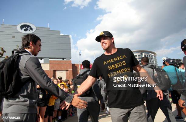 Former linebacker Chad Greenway of the Iowa Hawkeyes and Minnesota Vikings greets players as they arrive before the match-up against the Penn State...