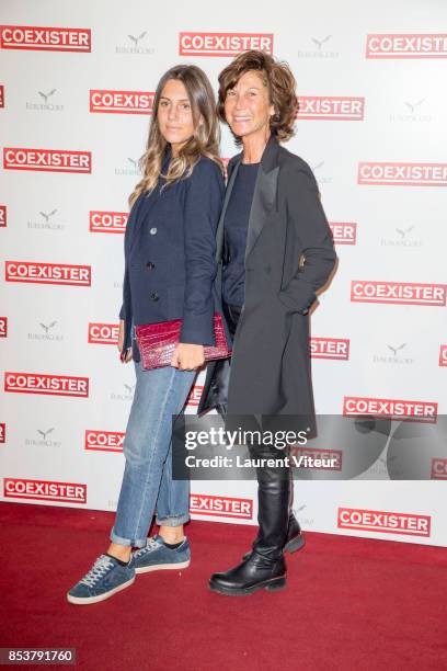 Sylvie Rousseau and her daughter attend "Coexister" Paris Premiere at Le Grand Rex on September 25, 2017 in Paris, France.