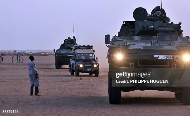 Polish Soldiers, part of the European Force , patrol a village near Iriba, in eastern Chad on March 11, 2009 four days before the end of the European...