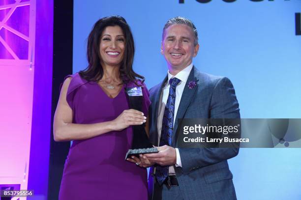 Director of Media Operations at Cisco Systems Samira Panah Bakhtiar and Vice President of Global Service Provider Cisco Systems John Dorval pose with...