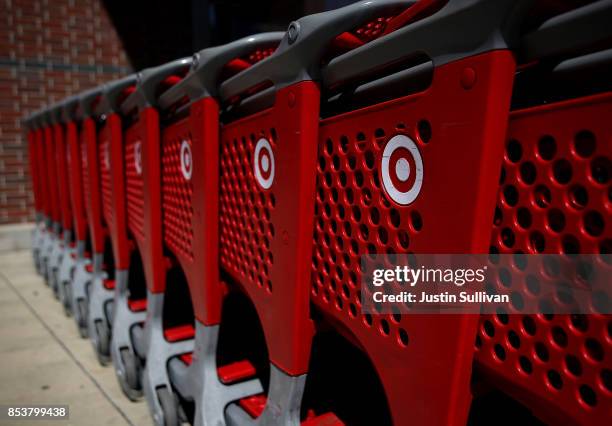 The Target logo is displayed on shopping carts outside of Target store on September 25, 2017 in San Rafael, California. Target Corp. Annouced plans...