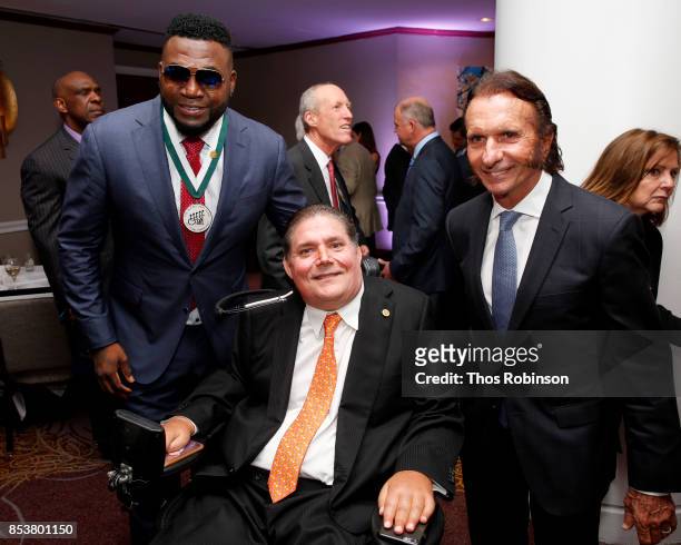 Honoree David Ortiz, GSLD Host Marc Buoniconti and Brazilian racing driver Emerson Fittipaldi attend the 32nd Annual Great Sports Legends Dinner To...