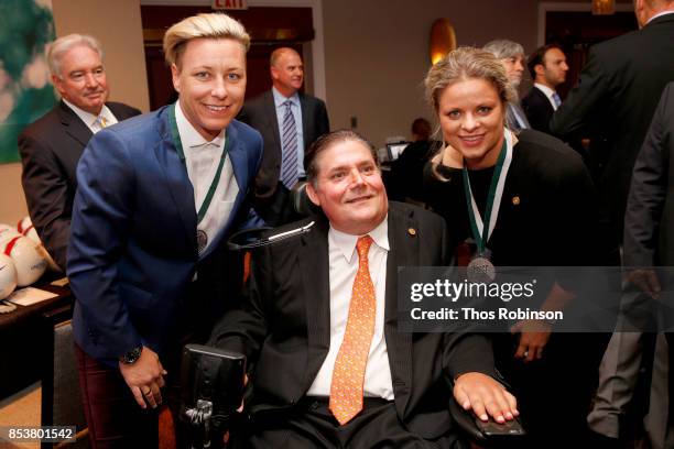 Abby Wambach, Marc Buoniconti and Kim Clijsters attend the 32nd Annual Great Sports Legends Dinner To Benefit The Miami Project/Buoniconti Fund To...