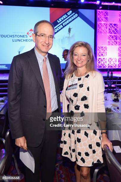 Chairman and CEO of the Comcast Corporation Brian L. Roberts and WICT Board of Directors Karen Buchholz pose for a photo during the WICT Leadership...