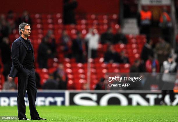 Inter Milan's Portuguese coach Jose Mourinho waits for the kick off against Manchester United in their UEFA Champions League second round second leg...
