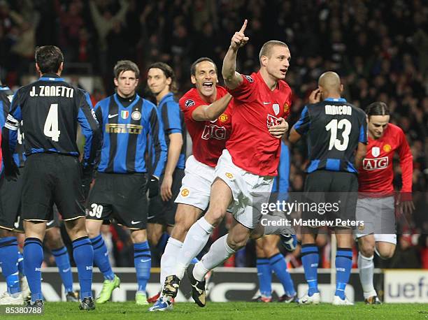 Nemanja Vidic of Manchester United celebrates scoring their first goal during the UEFA Champions League First Knockout Round Second Leg match between...