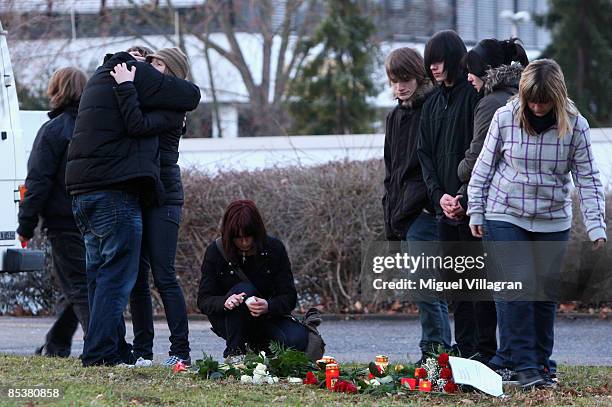 People put flowers in front of the Albertville-School Centre on March 11, 2009 in Winnenden near Stuttgart, Germany. A 17 year old ex pupil attacked...