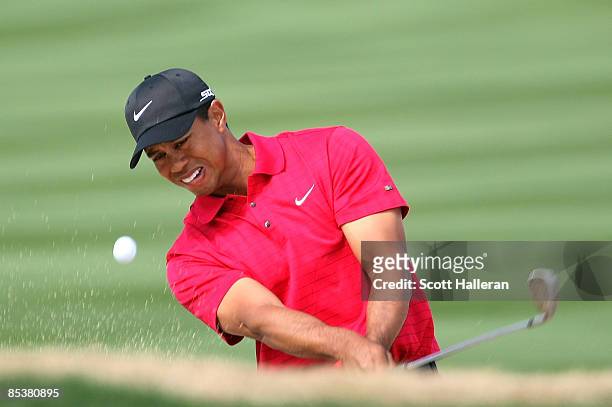 Tiger Woods plays a bunker shot on the 18th hole during the Championship match of the WGC-Accenture Match Play Championship at The Gallery at Dove...