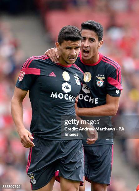 Benfica's Andre Almeida attempts to calm down team-mate Benite after fouling Arsenal's Joel Campbell