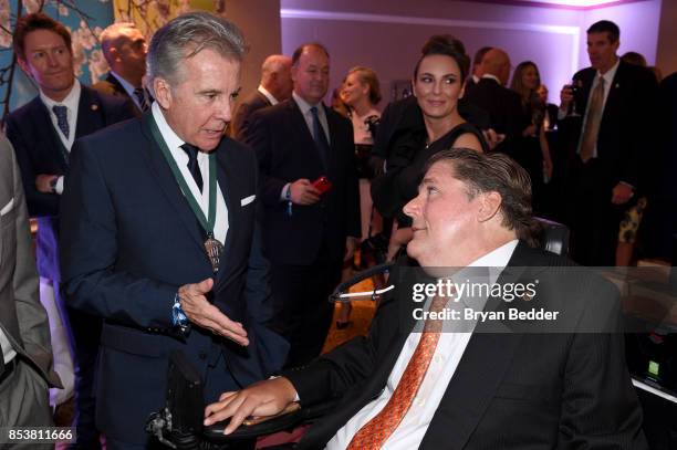 John Walsh and President, the Miami Project and The Buoniconti Fund, Marc Buoniconti attend the 32nd Annual Great Sports Legends Dinner To Benefit...