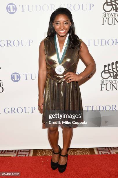 Honoree Simone Biles attends the 32nd Annual Great Sports Legends Dinner To Benefit The Miami Project/Buoniconti Fund To Cure Paralysis at New York...