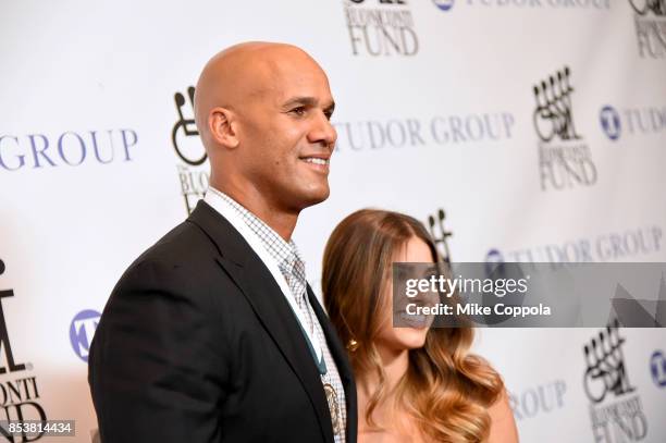 Honoree Jason Taylor and Monica Velasco attends the 32nd Annual Great Sports Legends Dinner To Benefit The Miami Project/Buoniconti Fund To Cure...