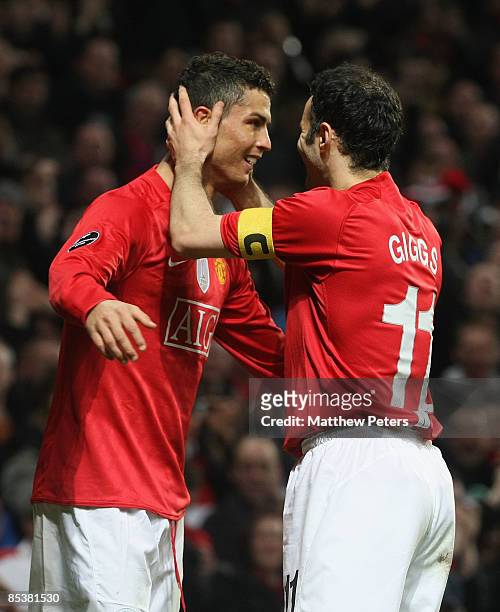 Cristiano Ronaldo of Manchester United celebrates scoring their second goal during the UEFA Champions League First Knockout Round Second Leg match...