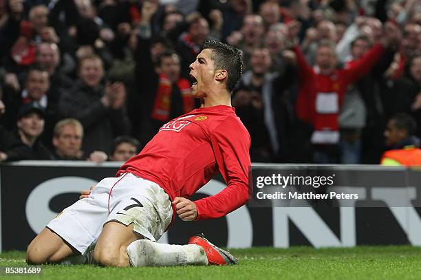 Cristiano Ronaldo of Manchester United celebrates scoring their second goal during the UEFA Champions League First Knockout Round Second Leg match...