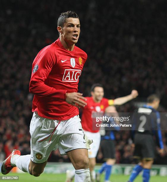 Cristiano Ronaldo of Manchester United celebrates scoring their second goal during the UEFA Champions League First Knockout Round Second Leg match...