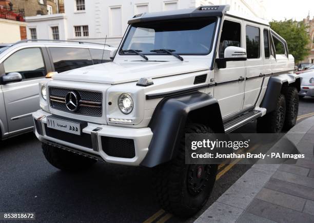 An AMG G63 6X6 bearing Arabic inscribed registration plates parked outside Harrods department store, Knightsbridge.