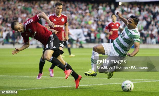 Celtic's Emilio Izaguirre and Legia Warsaw's Lukasz Broz battle for the ball during the Champions League Qualifying at Murrayfield, Edinburgh.