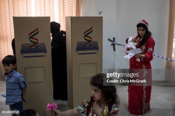 Woman prepares to cast her referendum vote at a voting station on September 25, 2017 in Erbil, Iraq. Despite strong objection from neighboring...