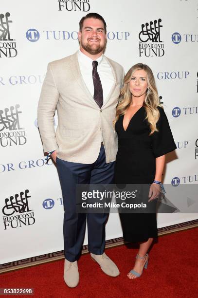 New York Jets Offensive Lineman Brent Qvale and Melissa Qvale attend the 32nd Annual Great Sports Legends Dinner To Benefit The Miami...