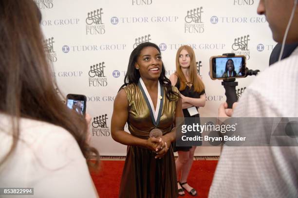 Honoree Simone Biles attends the 32nd Annual Great Sports Legends Dinner To Benefit The Miami Project/Buoniconti Fund To Cure Paralysis Legends...