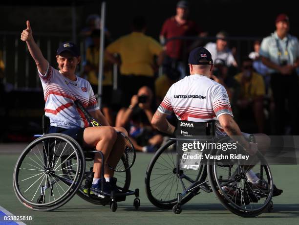 Cornelia Oosthuizen and Kirk Hughes of the United Kingdom celebrate victory in the Wheelchair Tennis Bronze medal match against Sean Lawler and...