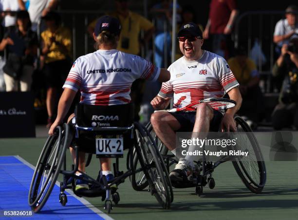 Cornelia Oosthuizen and Kirk Hughes of the United Kingdom celebrate victory in the Wheelchair Tennis Bronze medal match against Sean Lawler and...