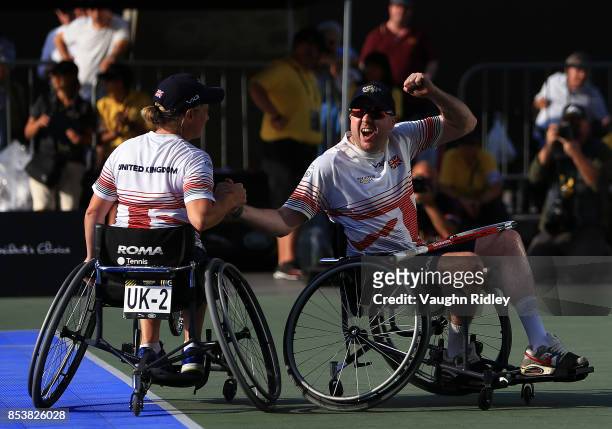 Cornelia Oosthuizen and Kirk Hughes of the United Kingdom celebrate victory in the Wheelchair Tennis Bronze medal match against Sean Lawler and...