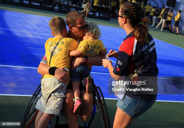Kevin Drake of the United Kingdom celebrates with his family after victory in the Wheelchair Tennis Gold medal match against Glenn Barnes and Aaron...