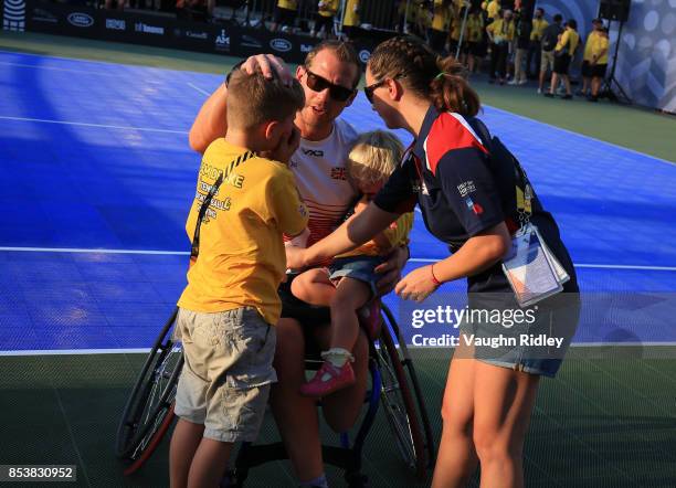 Kevin Drake of the United Kingdom celebrates with his family after victory in the Wheelchair Tennis Gold medal match against Glenn Barnes and Aaron...