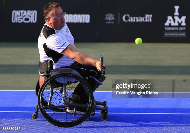 Glenn Barnes of New Zealand plays a shot in the Wheelchair Tennis Gold medal match against Kevin Drake and Alexander Krol of the United Kingdom...