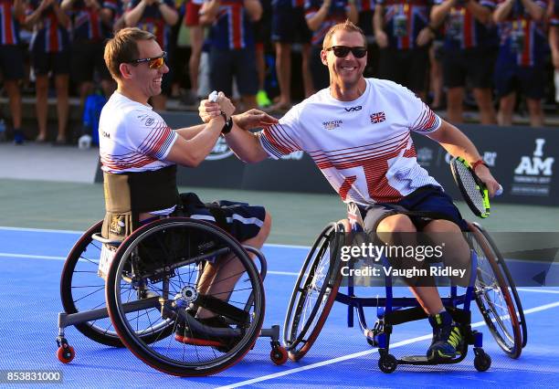 Alexander Krol and Kevin Drake of the United Kingdom celebrate victory in the Wheelchair Tennis Gold medal match against Glenn Barnes and Aaron Gibbs...