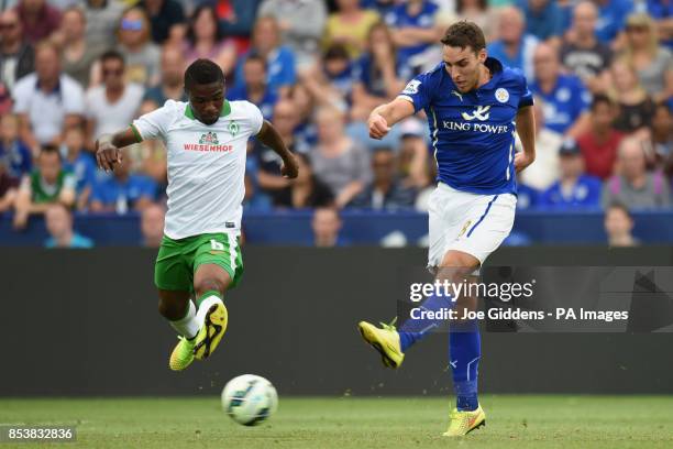 Leicester City's Matty James fires in a shot past Werder Bremen's Cedrick Makiadi during the pre-season friendly at the King Power Stadium, Leicester.