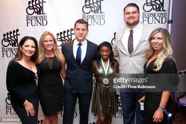 Gloria Estefan, Kelly Murro, Tom Murro, Simone Biles, Brent Qvale and Melissa Qvale attend the 32nd Annual Great Sports Legends Dinner To Benefit The...