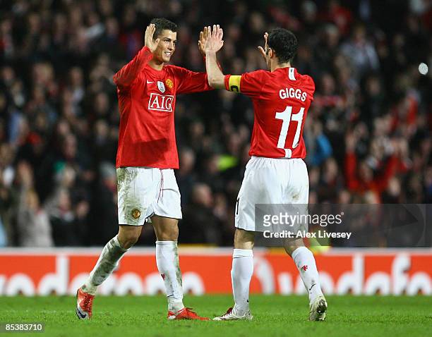 Cristiano Ronaldo of Manchester United celebrates with team mate Ryan Giggs at the end of the UEFA Champions League Round of Sixteen, Second Leg...