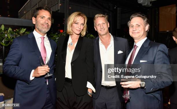 Guest, Uma Thurman, Ward Simmons and Jason Binn attend the celebration of DuJour's fall cover star Uma Thurman at The Magic Hour at Moxy Times Square...