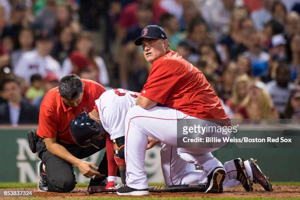 Manager John Farrell reacts as Eduardo Nunez of the Boston Red Sox is injured during an at bat during the fourth inning of a game against the Toronto...