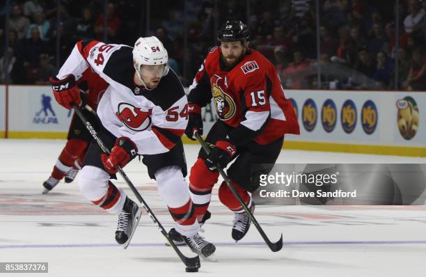 Zack Smith of the Ottawa Senators back checks against Ryan Kujawinski during Kraft Hockeyville Canada on September 25, 2017 at Credit Union Place in...