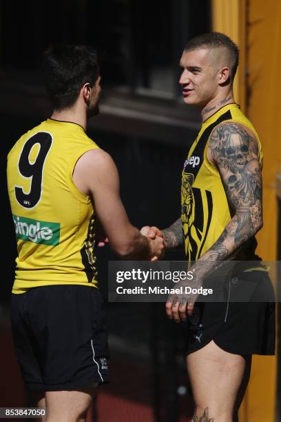 Dustin Martin is congratulated by Trent Cotchin after winning the Brownlow medal last night ahead of the Richmond Tigers AFL training session at Punt...