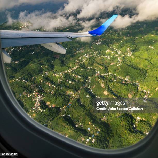 mountainous terrain on martinique - plane wing stock pictures, royalty-free photos & images