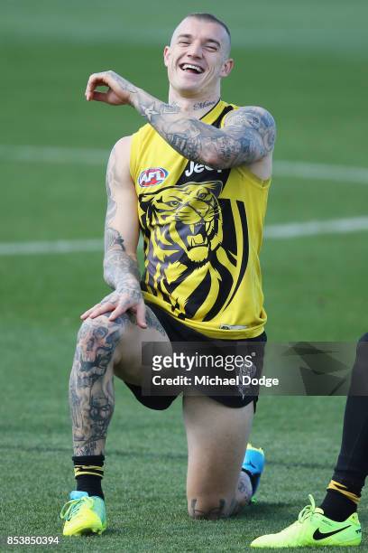 Dustin Martin, a winner of the Brownlow medal last night, reacts ahead of the Richmond Tigers AFL training session at Punt Road Oval on September 26,...