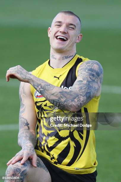 Dustin Martin, a winner of the Brownlow medal last night, reacts ahead of the Richmond Tigers AFL training session at Punt Road Oval on September 26,...