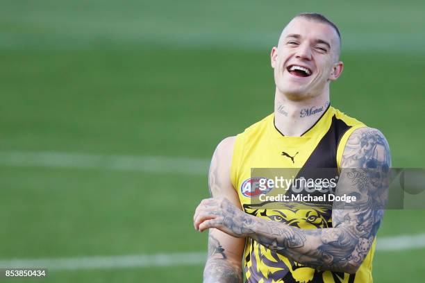 Dustin Martin, a winner of the Brownlow medal last night, reacts ahead of the Richmond Tigers AFL training session at Punt Road Oval on September 26,...